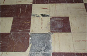 A floor with some brown and white squares on it